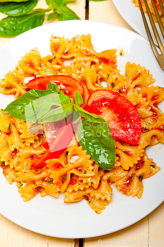 Image of Italian pasta farfalle butterfly bow-tie and tomato sauce