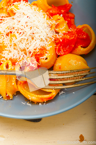 Image of Italian snail lumaconi pasta with tomatoes