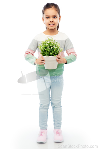 Image of happy smiling girl holding flower in pot