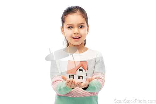 Image of smiling girl holding house model