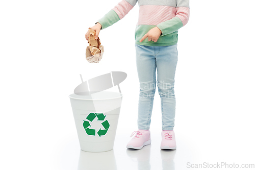 Image of girl throwing paper waste into rubbish bin