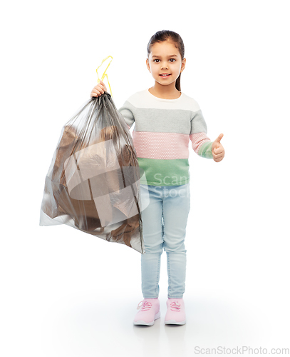 Image of smiling girl with paper garbage in plastic bag