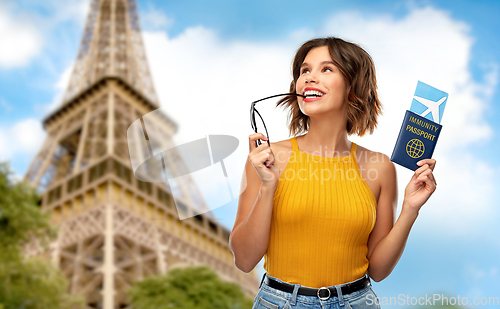 Image of happy woman with air ticket and immunity passport