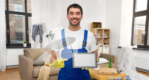 Image of male worker or cleaner showing tablet pc at home