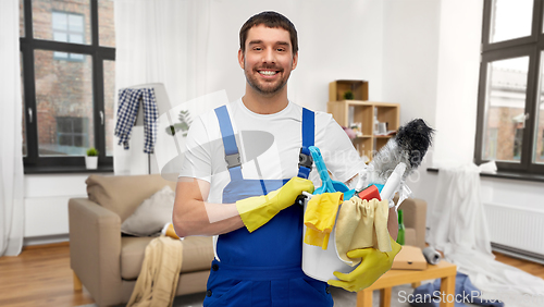 Image of male cleaner with cleaning supplies at home