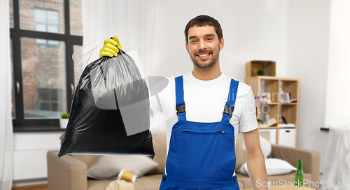 Image of male worker or cleaner with garbage bag at home