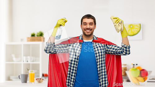 Image of smiling man in superhero cape with rag and cleaner