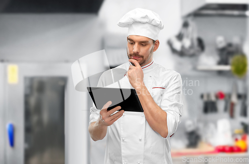 Image of male chef with tablet pc at restaurant kitchen