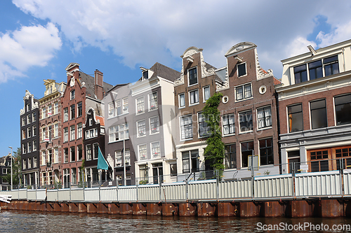 Image of Amsterdam downtown, Traditional old houses and a canals. Holland