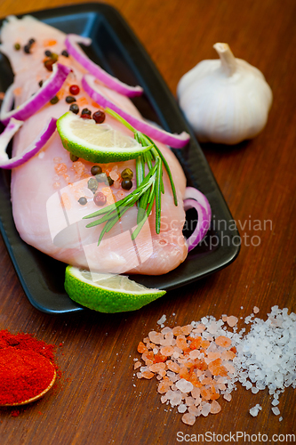 Image of fresh organic chicken breast with herbs and spices