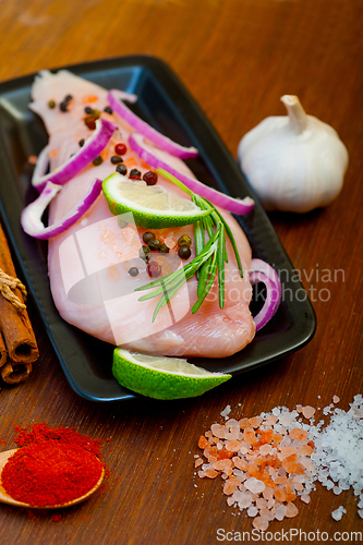 Image of fresh organic chicken breast with herbs and spices