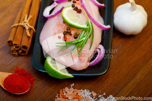 Image of fresh organic chicken breast with herbs and spices