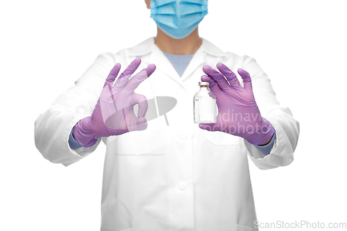 Image of close up of doctor with medicine showing ok sign