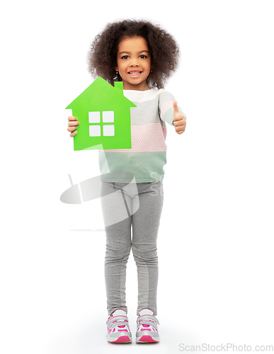 Image of smiling african girl holding green house icon