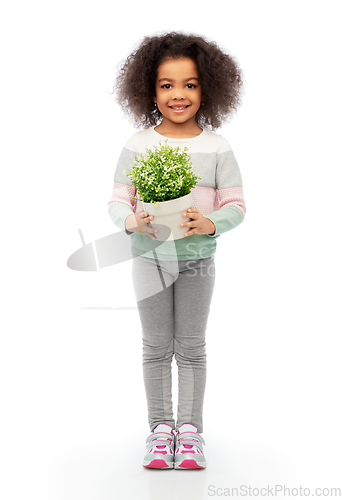 Image of happy smiling girl holding flower in pot