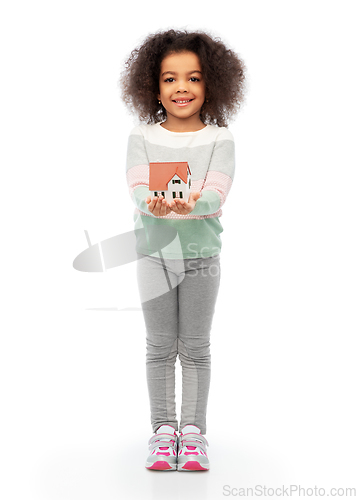 Image of smiling african american girl holding house model