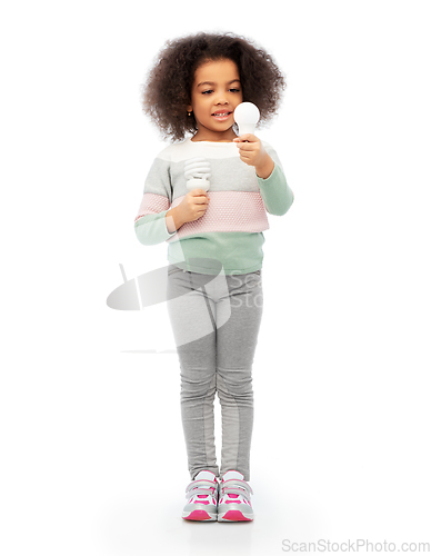 Image of african american girl with different light bulbs