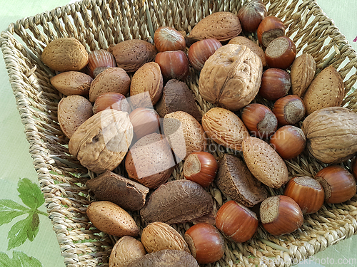 Image of Mix of different types nuts in wicker dish