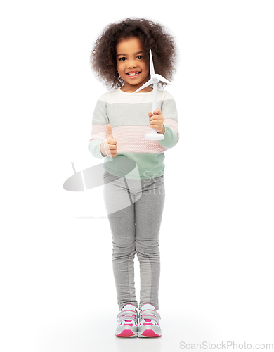 Image of happy african american girl with toy wind turbine