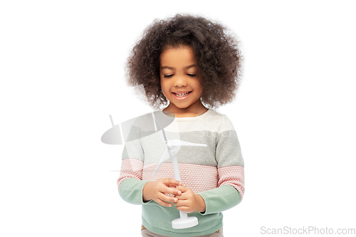 Image of happy african american girl with toy wind turbine