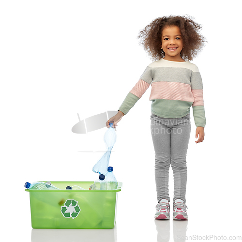 Image of happy african american girl sorting plastic waste