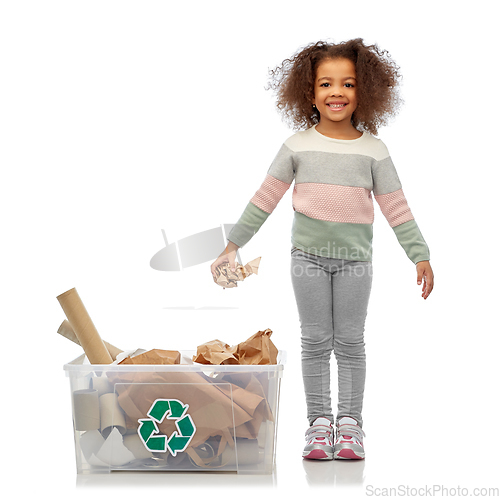 Image of smiling african american girl sorting paper waste