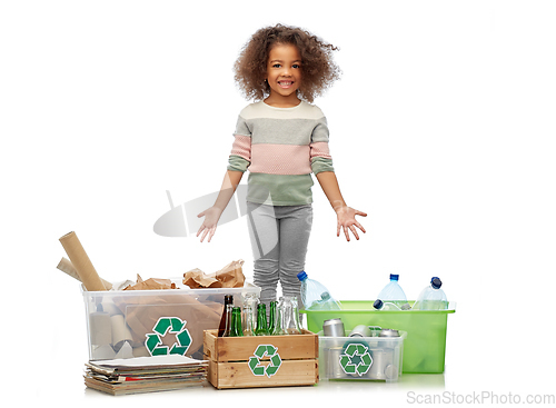 Image of happy girl sorting paper, metal and plastic waste