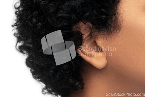 Image of close up of african american woman's ear