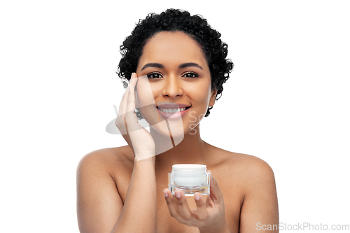 Image of young african american woman with moisturizer