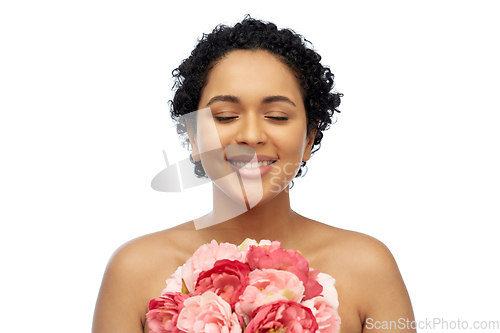 Image of portrait of african american woman with flowers