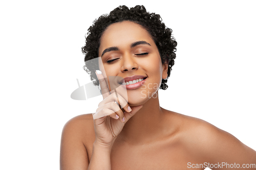 Image of young african american woman with moisturizer