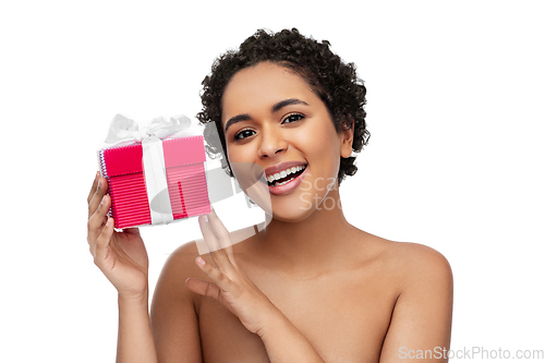 Image of portrait of young african american woman with gift