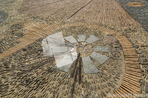 Image of Unusual pavement with creative pattern from metal details, sea p