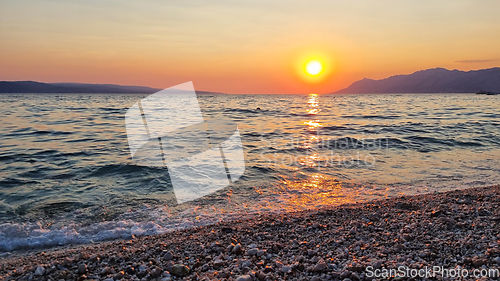 Image of Beautiful red sunset over the Adriatic sea. Makarska Riviera-Biokovo, Dalmatia, Croatia, Europe