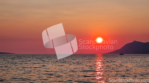 Image of Beautiful red sunset over the Adriatic sea. Makarska Riviera-Biokovo, Dalmatia, Croatia, Europe