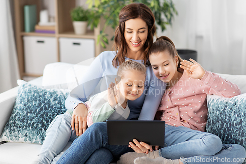 Image of mother and children having video call on tablet pc