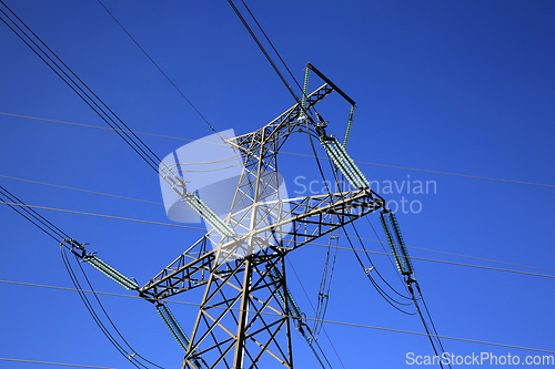 Image of Overhead Transmission Lines against Blue Sky