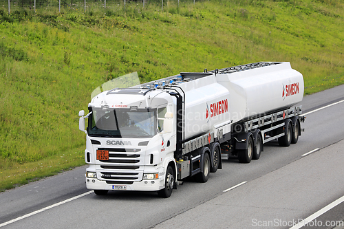 Image of White Scania Tank Truck Hauls ADR Dangerous Goods