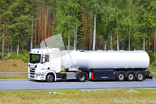 Image of White Scania Semi Tanker at Speed on Motorway