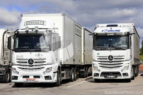 Image of Two White Mercedes-Benz Actros Heavy Trucks Parked