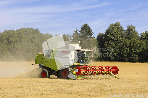 Image of Claas Tucano 570 Combine Harvester in Wheat Field