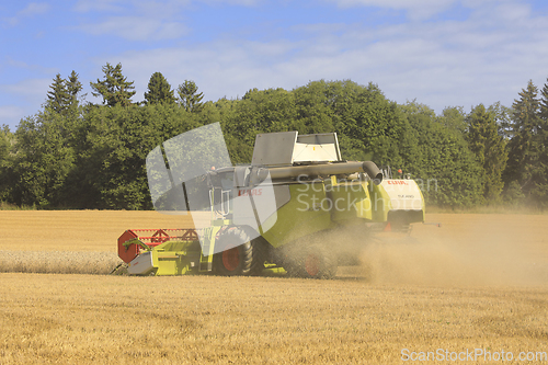 Image of Harvesting Wheat with Claas Tucano 570 Combine Harvester