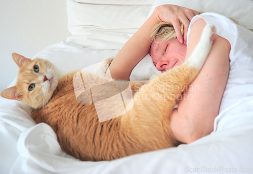 Image of Female beauty sleeping with her cat.