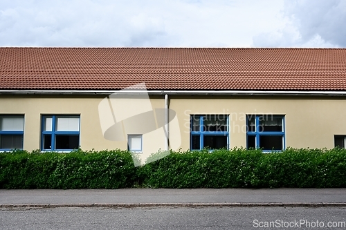 Image of front view of a building with a tiled roof