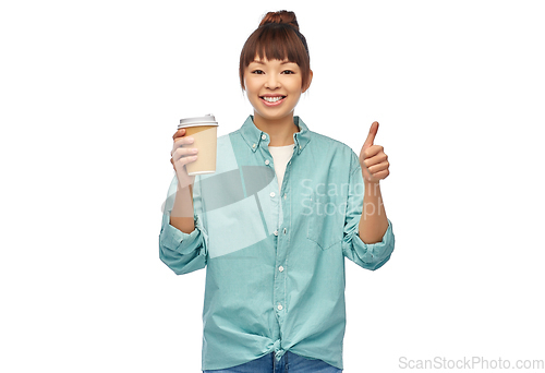 Image of asian woman with coffee cup showing thumbs up