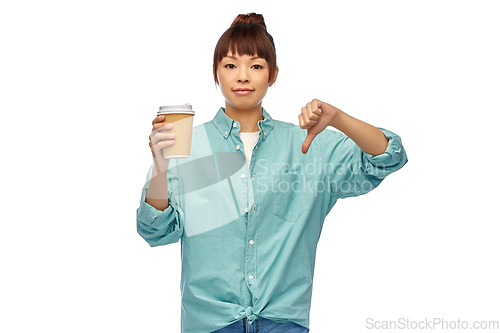 Image of asian woman with coffee cup showing thumbs down