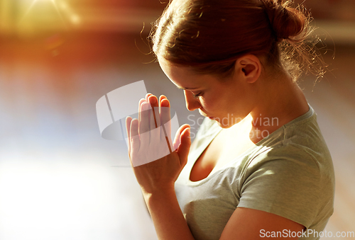 Image of close up of woman meditating at yoga studio