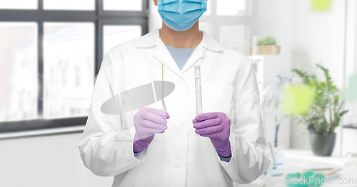 Image of female doctor with test tube and cotton swab