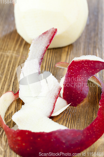 Image of red peeled apple peel