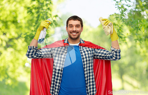 Image of smiling man in superhero cape with rag and cleaner